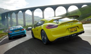 A Porsche takes on a BMW on a typically picturesque stretch of road