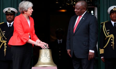 Item in the bagging area … Theresa May collects the SS Mendi Bell from South African president Cyril Ramaphosa in 2018.