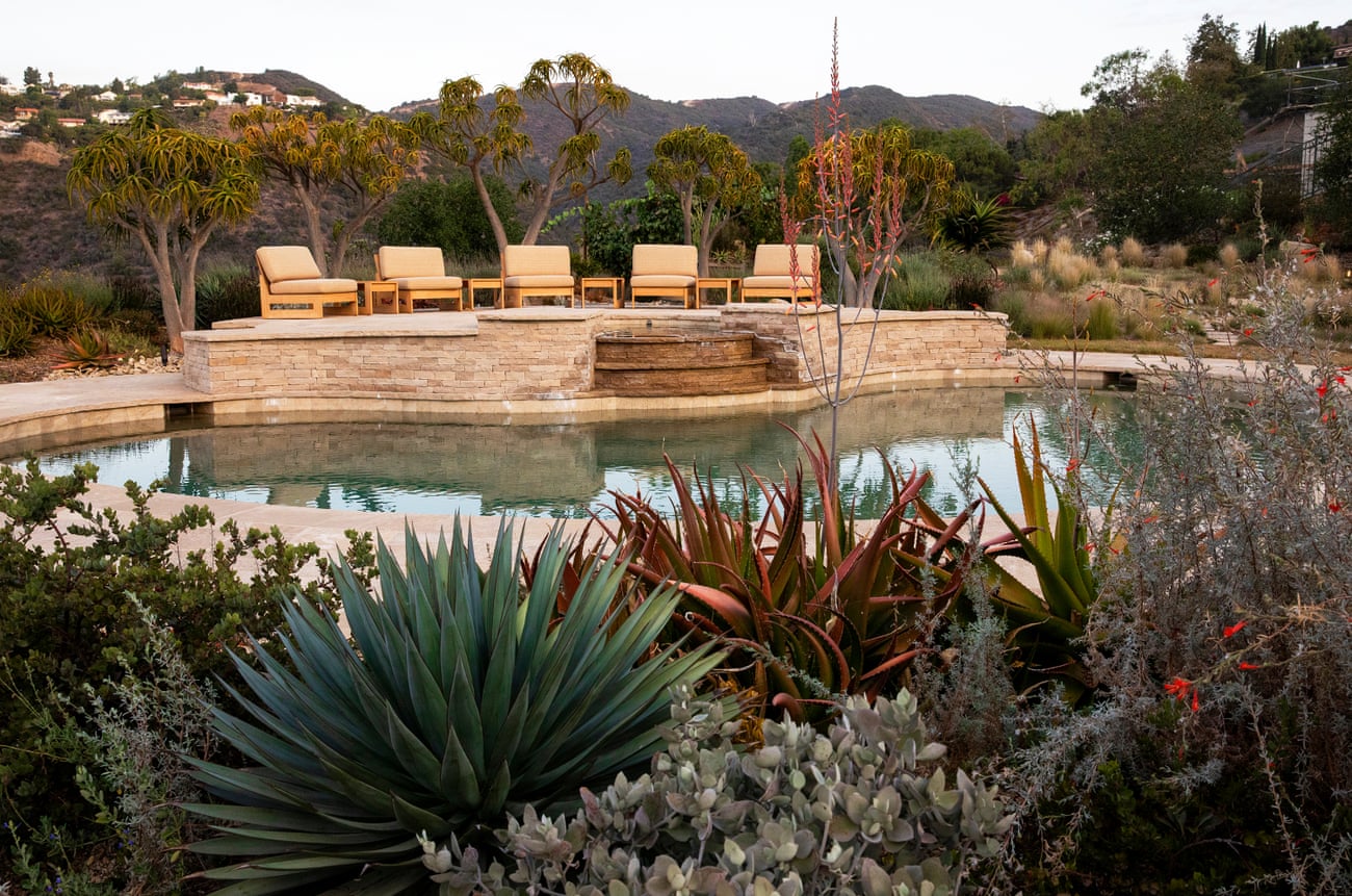 chairs next to a pond