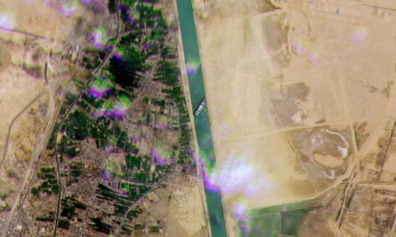 A satellite image showing the Ever Given lodged sideways across the waterway of Egypt’s Suez Canal