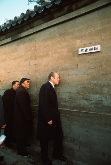 President Gerald Ford presses his ear to the Whispering Wall