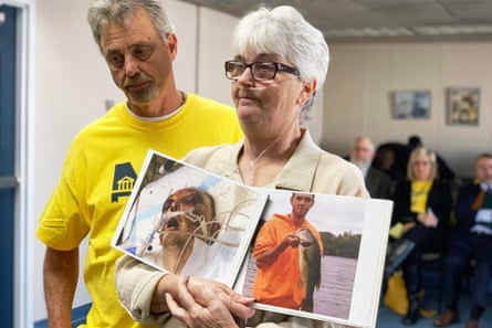 A woman holds up two photos of her son, one with him bruised and in a hospital bed and another where he’s happily fishing