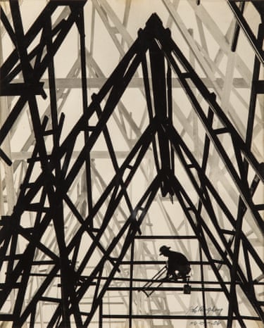 A worker crouches silhouetted amid towering criss-crossed steel construction beams