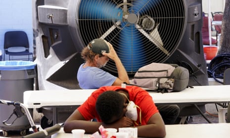 People try to keep cool at a cooling center in Phoenix, Arizona, where temperates reached 100F. 