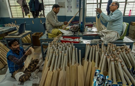 At the factory of Sanspareils Greenlands (SG), one of India’s four largest cricket equipment manufacturers, in Meerut, Uttar Pradesh, workers affix the brand’s SG stickers to the body of finished bats before they are packed for shipment to Mumbai, throughout India and abroad.