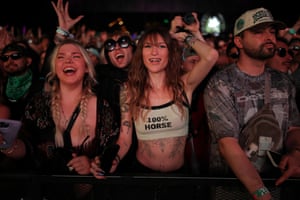 A woman wearing a ‘100% horse’ top