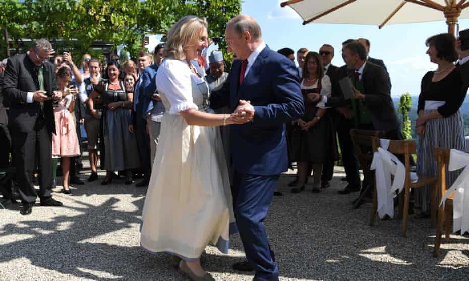 Austrian foreign minister Karin Kneissl and Russian President Vladimir Putin dance at her wedding. 
