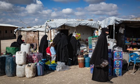 SYRIA: President Assad sworn in for fourth term with 95% of vote 9 Women shop in a makeshift market inside al-Hawl camp in Syria