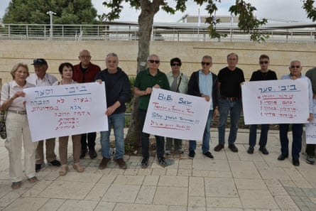Former Israeli ambassadors and employees demonstrate against settler violence in the West Bank outside the foreign ministry in Jerusalem, holding placards