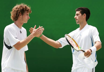 Andy Murray and Novak Djokovic celebrate a point in their doubles match against Fabrice Santoro and Nenad Zimonjic during day four of the 2006 Australian Open at Melbourne Park.