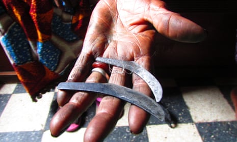 Fanta Kanté with knives used for FGM, passed down to her from her ancestors.