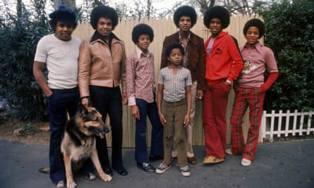 The Jacksons with their father Joe in their backyard (l to r) Tito, Joe, Michael, Randy, Jackie, Jermaine and Marlon.