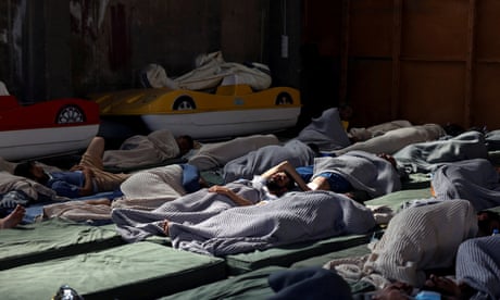 Survivors recuperate in a shelter