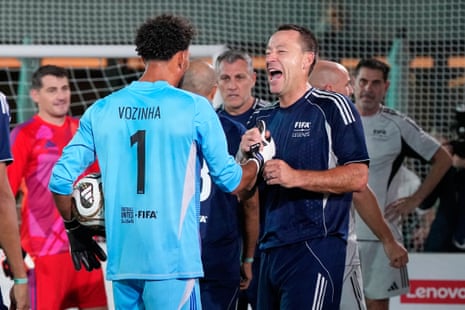 Vozinha and John Terry share a joke.