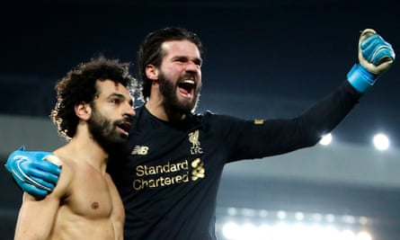 Mohamed Salah celebrates with Alisson after scoring Liverpool’s second goal against Manchester United in January 2020 from the goalkeeper’s pass.
