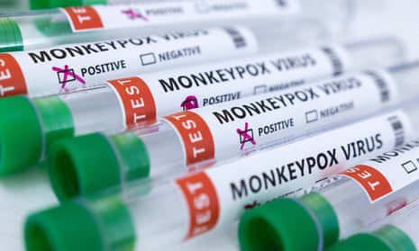 Test tubes labeled 'monkeypox virus' and marked positive are on a white background.