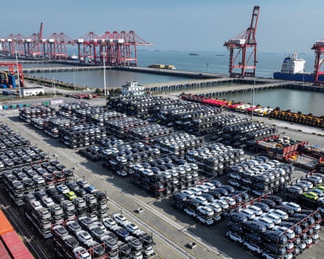 Hundreds of cars stacked on a quayside