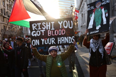 Protesters holding placards and Palestinian flags take part in a ‘National March For Palestine’ in central London on November 25, 2023, calling for a ceasefire in the conflict between Israel and Hamas.