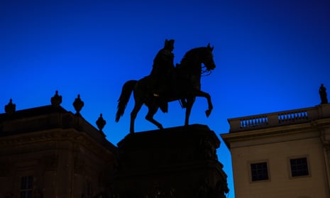 A statue of Frederick the Great with the lights switched off in Berlin in July