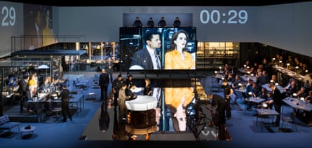 The stage is transformed into a studio … Tunji Kasim and Michelle Dockery (on screen) in Network.