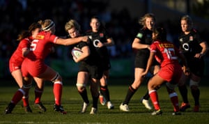 Marlie Parker of England is tackled by Courtney Holtkamp of Canada during the Quilter International match between England Women and Canada Women at Castle Park