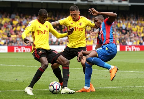 Watford’s Didier Ibrahim Ndong and Christian Kabasele battle for the ball with Wilfried Zaha.