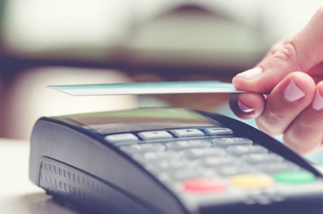 A person tapping a credit card