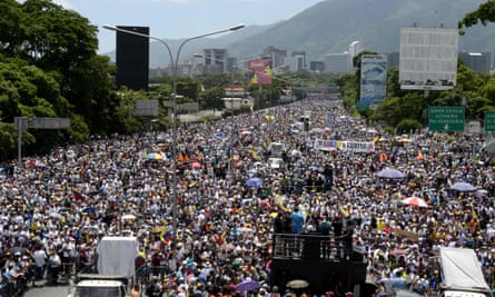 Activists block a major motorway in eastern Caracas on 20 May in protest against the government of President Maduro.