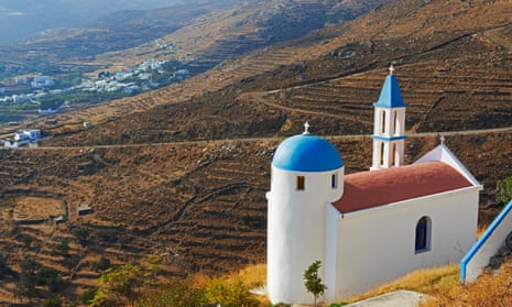 Blue-domed churches, such as this one near the village of Aetofolia, are a common sight on Tinos, Greece.