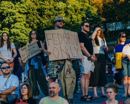 A soldier holds a sign reading ‘Fedorov only’ during a protest in Kyiv