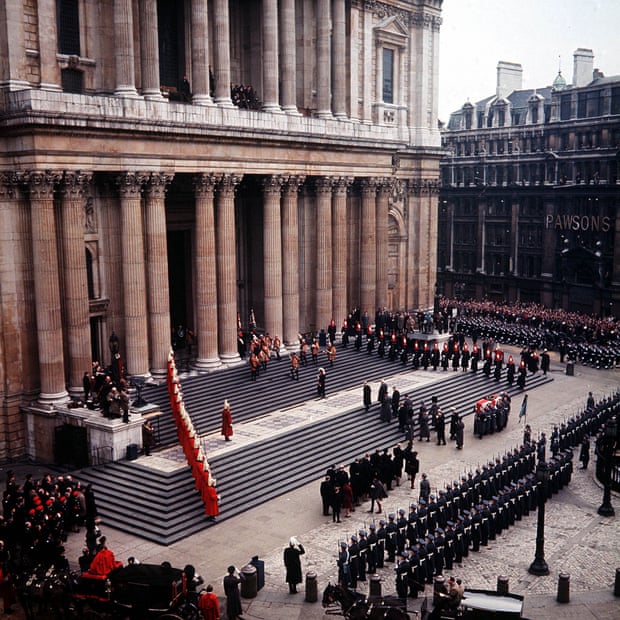A complex line of soldiers surrounds the steps to St. Paul's Cathedral, and mourners walk, visible from afar