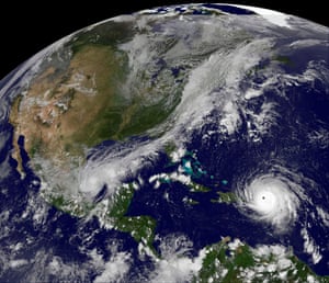 Hurricane Irma, a category five storm, churns across the Atlantic Ocean past Puerto Rico and the over Dominican Republic.