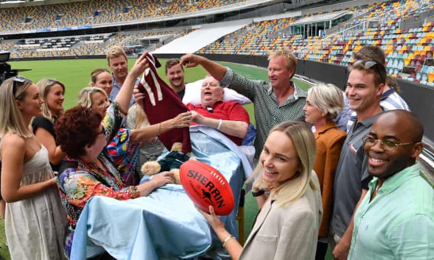 Former Queensland AFL great Ross Whyte, suffering from terminal prostate cancer, in March 2021 with family and friends who joined him in a visit to the Gabba in Brisbane to fulfil his last wish.