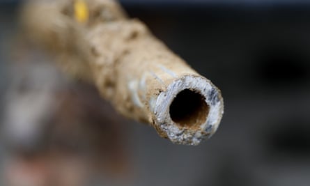 A lead pipe is shown after being replaced by a copper water supply line to a home in Michigan.