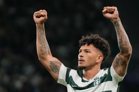 Luis Suarez raises both fists celebrating a goal for Sporting CP