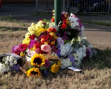 Flowers by a lamp-post left in tribute