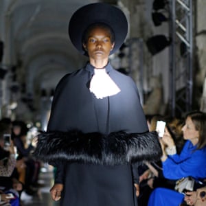 A model wears a creation inspired by clerical attire.