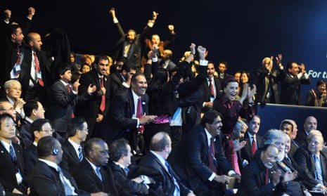 The Qatari delegation reacts by winning the right to host the 2022 World Cup.
