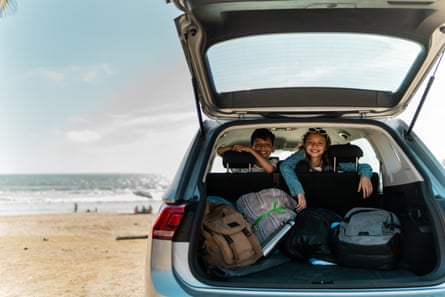 When smaller was beautiful … children look out from their family’s hatchback.