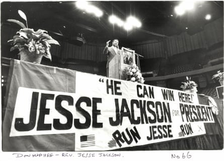 black and white photo of man speaking at podium, a sign below him saying 'He can win here! Jesse Jackson for president / Run Jesse run'