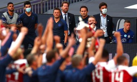 Frank Lampard and his Chelsea players and staff look on as Arsenal lift the FA Cup at Wembley.