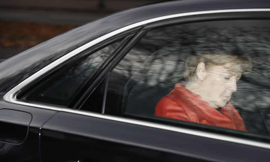 German Chancellor Angela Merkel leaves the presidential residence in Berlin in her car.
