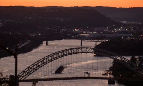 A coal barge makes its way up the Ohio River in Pittsburgh this August.