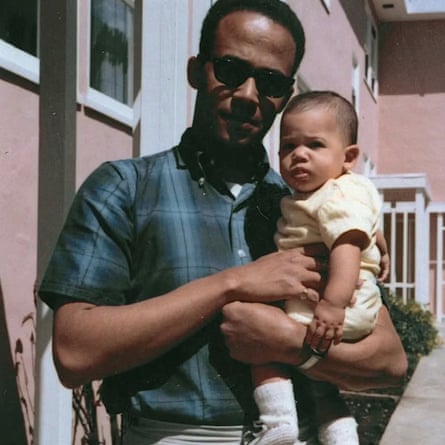 Donald Harris holding his daughter Kamala in April 1965