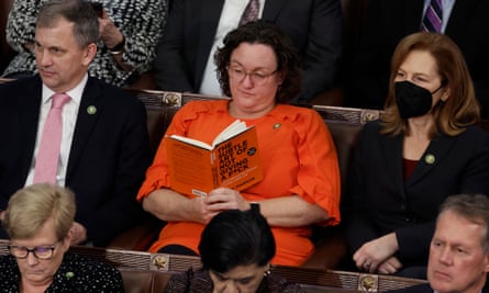 Katie Porter reads a book in the House Chamber during the fourth day of Speaker elections.