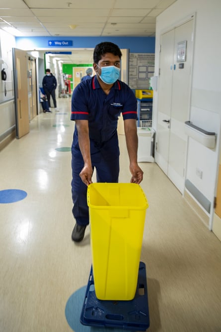 At his last job of the shift, Sebastian empties feces bags for patients with kidney failure.