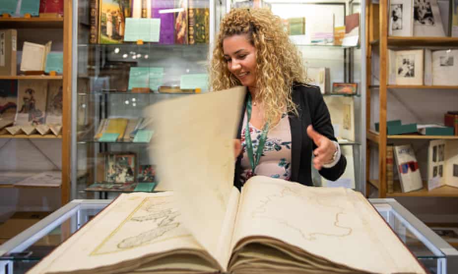 A buyer examines a rare tome the Antiquarian Booksellers Association’s rare book fair Firsts. 