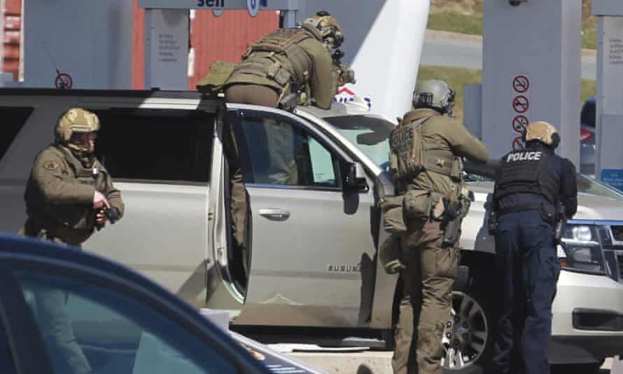 Royal Canadian Mounted Police officers surround a suspect at a gas station in Enfield, Nova Scotia, on 19 April 2020 after Canada’s worst mass shooting.