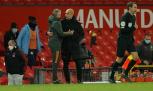 Ole Gunner Solskjaer and Pep Guardiola embrace at full-time.