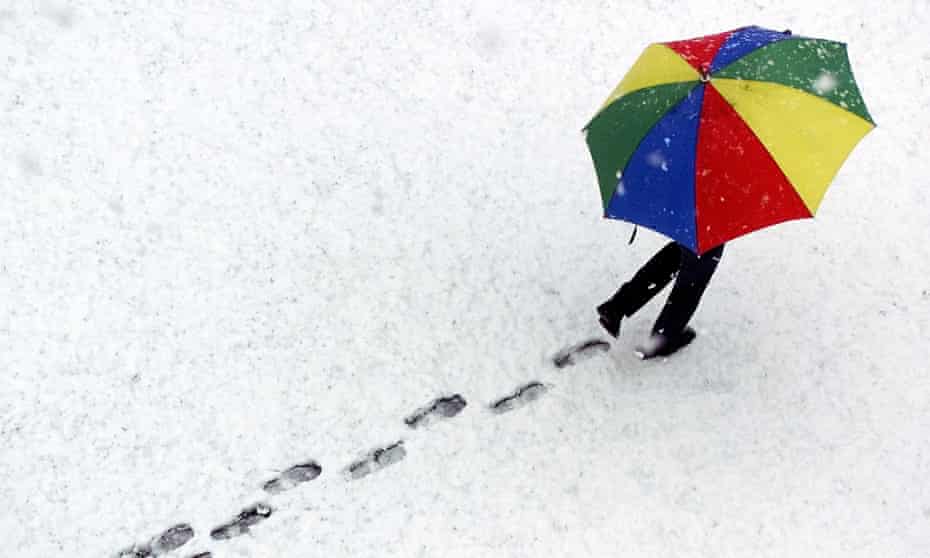 Woman with umbrella, Davos, Switzerland.